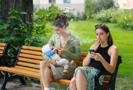 Damage Prevention - two women sitting on a bench with a baby