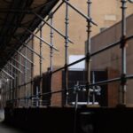 Height Safety - a building that has a bunch of pipes attached to it