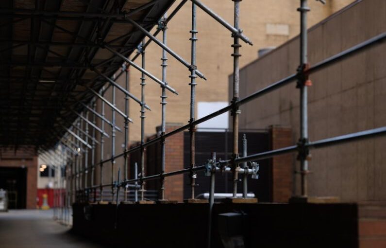 Height Safety - a building that has a bunch of pipes attached to it