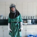 Chemical Safety - person wearing suit inside white painted room