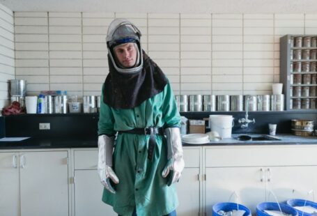 Chemical Safety - person wearing suit inside white painted room