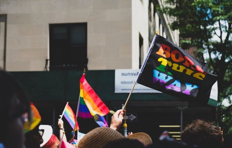 Rights Responsibilities - people holding flaglets near building