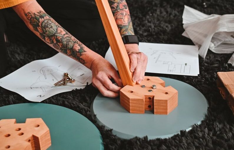 Diy Irrigation - a person drawing on a piece of paper