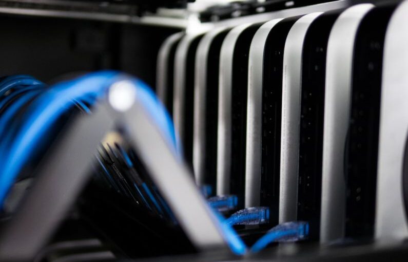 Cabling Bracing - a close up of a bunch of wires in a rack