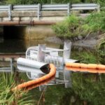 Cleanup Tools - white and brown boat on river during daytime