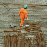 Construction Protection - man walking on construction site