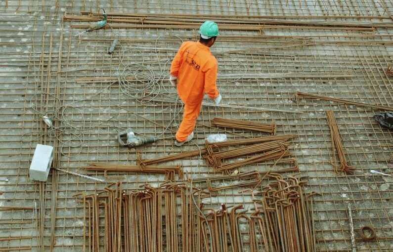Construction Protection - man walking on construction site
