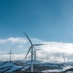 Environment Protection - wind turbines on snowy mountain under clear blue sky during daytime