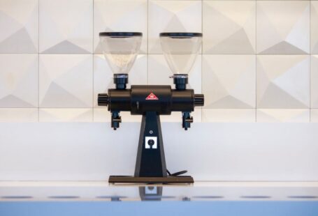 Stump Grinder - black and gray liquor dispenser near white wall