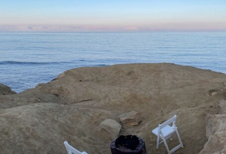 Soil Amendment - a couple of white chairs sitting on top of a rocky beach