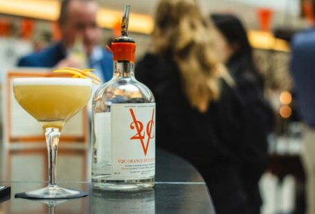 Summer Preparation - selective photography of clear glass bottle on table