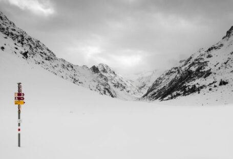 Winterizing Guide - snow covered mountain under cloudy sky during daytime