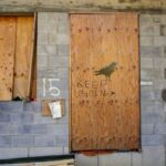 Storm Prep - brown wooden door with i love you print