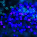 Holiday Lighting - a blurry photo of blue lights in the dark