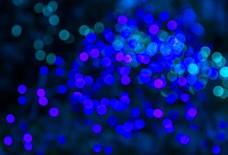 Holiday Lighting - a blurry photo of blue lights in the dark